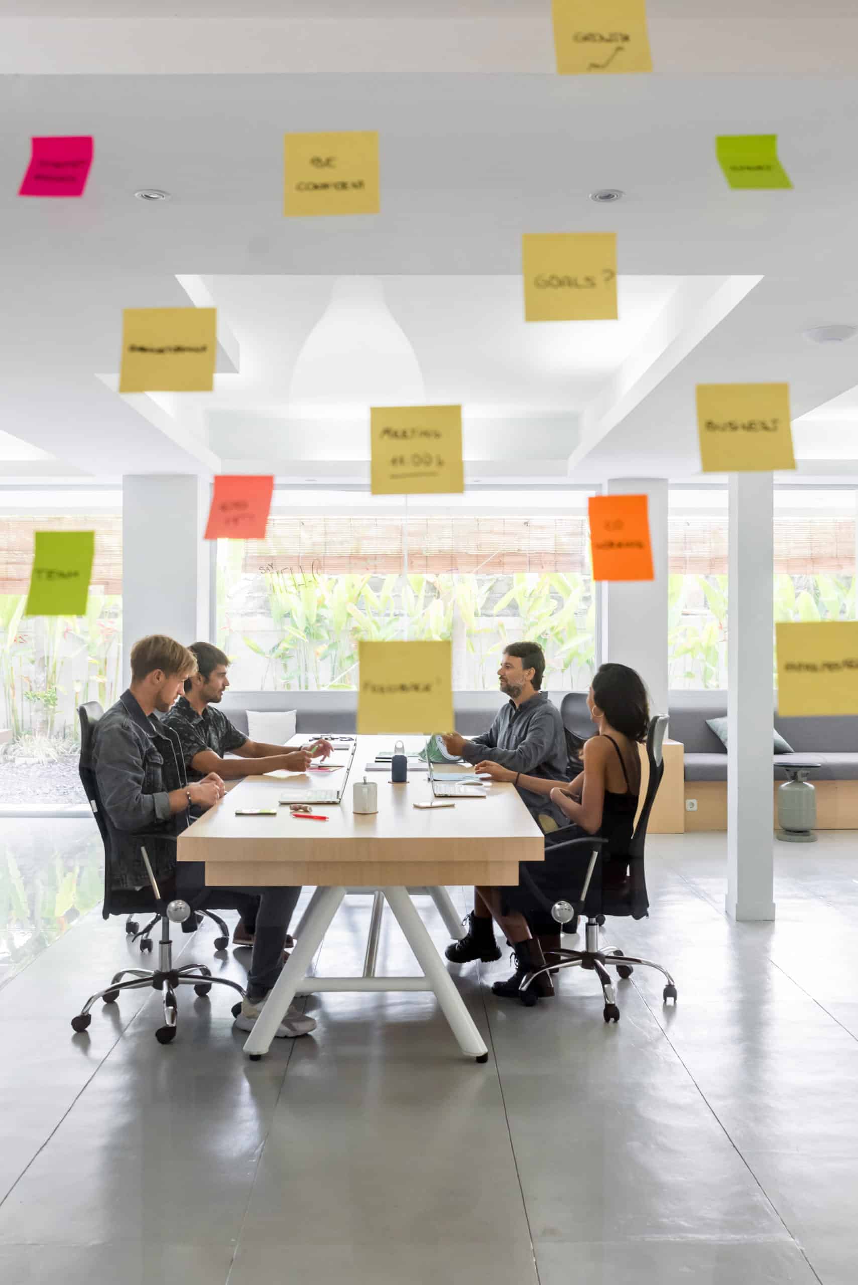 Group of young entrepreneurs working toghether in a coworking space