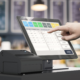 Cashier using a pos